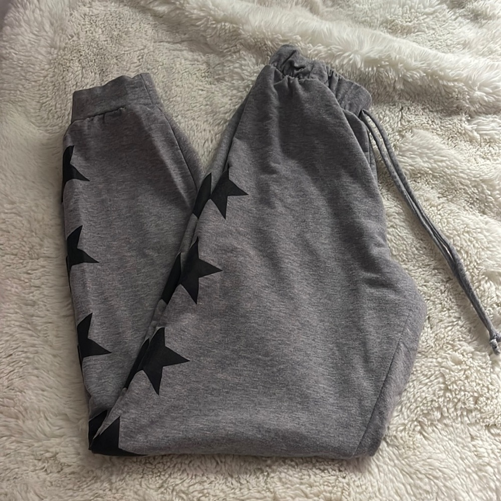 Grey Vyvacious sweatpants with black stars